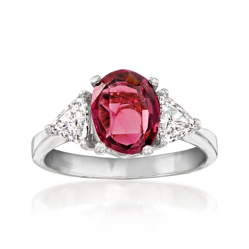 Vintage pink rhodolite ring in platinum with oval gemstone and diamond accents