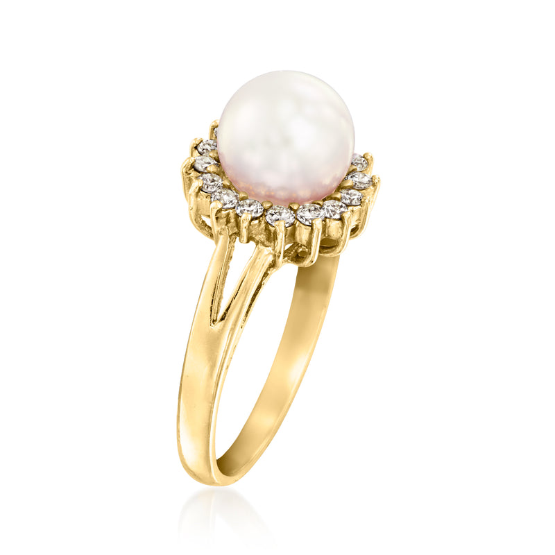 14kt yellow gold ring with round pearl center and diamond halo, side view