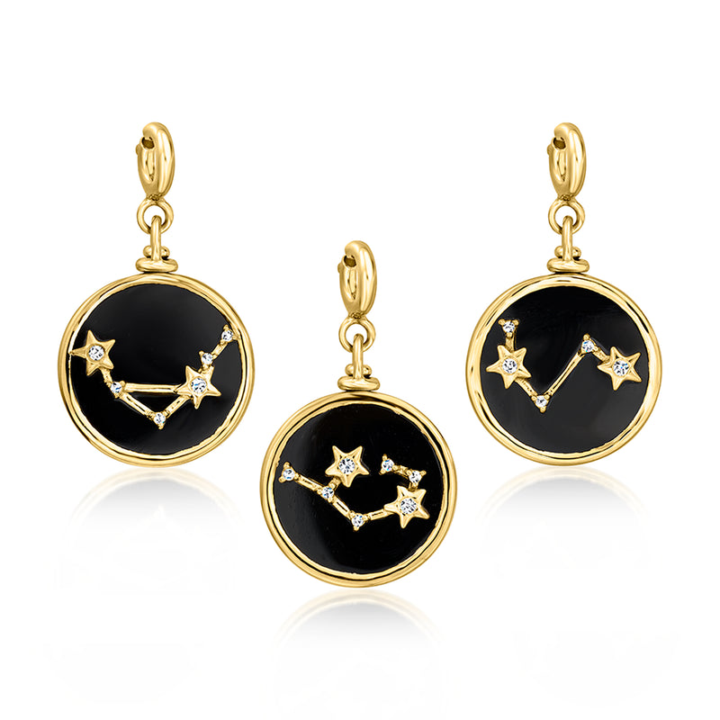Reversible round zodiac charm with black enamel and star constellation, gold-tone hoop bail