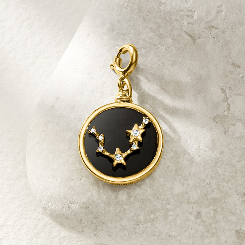 Reversible zodiac charm with black enamel constellation set in gold round frame