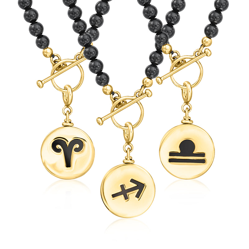 Gold reversible zodiac charms with black bead accents and round zodiac medallions