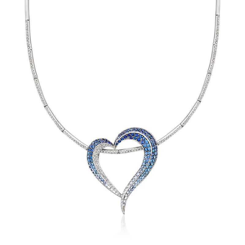 White gold heart pendant necklace with blue sapphire border and diamond accents