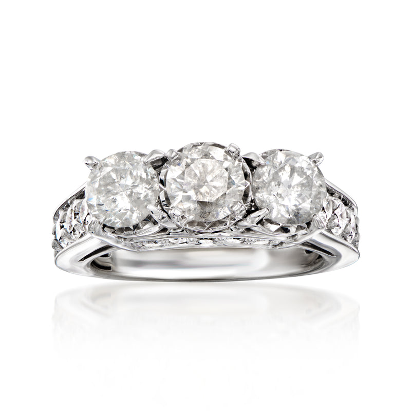 Vintage 14kt white gold diamond ring with three round stones
