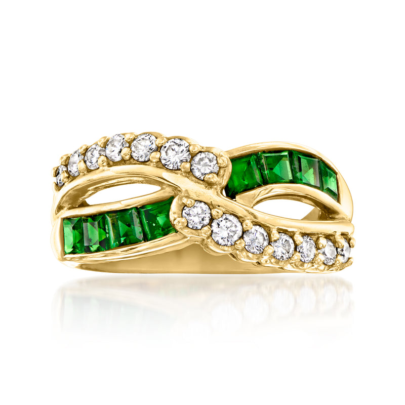 18kt yellow gold crisscross ring with emerald green baguette and diamond accents