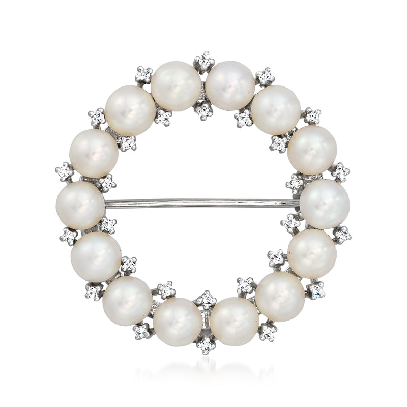 Pearl and diamond circle pin with white gold bar backing and cluster settings
