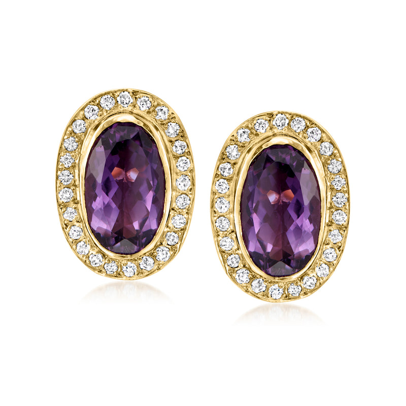 Oval amethyst and diamond halo stud earrings in 14kt yellow gold, post style.