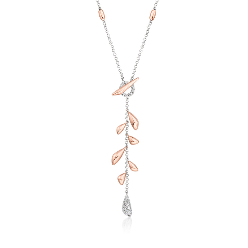 Two-tone gold Y-necklace with diamond toggle and leaf drop charms
