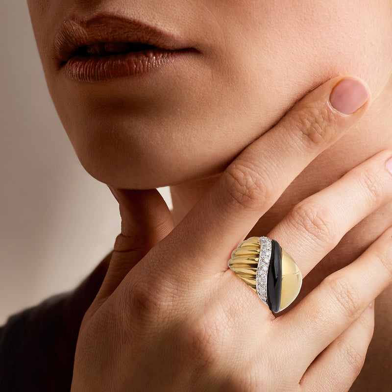 Onyx and diamond ring in 18kt yellow gold, shown on hand