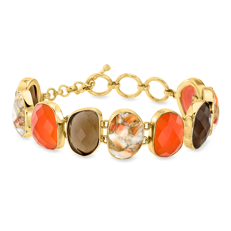 Gold-tone toggle bracelet with red, smoky, and multicolor gemstone cabochons