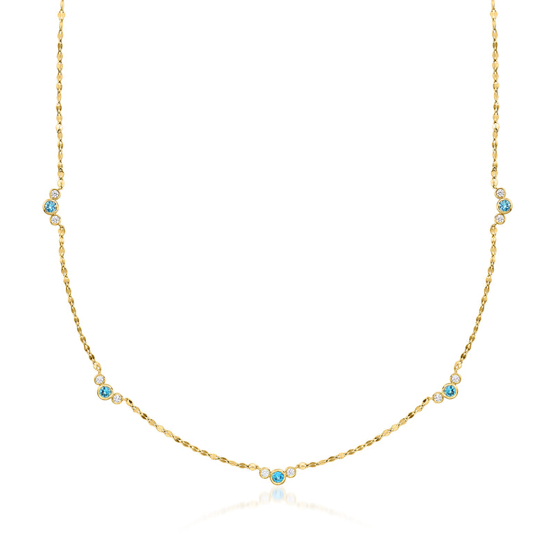 Gold station necklace with London blue topaz stones and small diamond accents