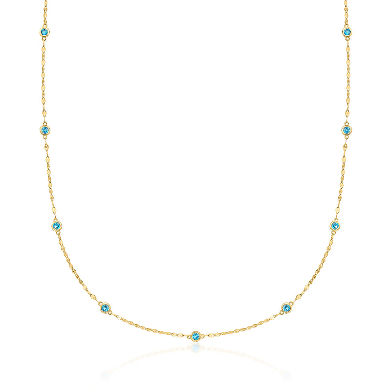 Gold-tone bezel-set blue topaz station necklace with small oval gemstones