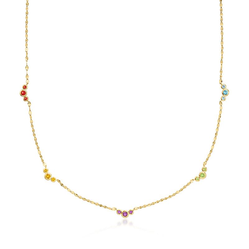 Gold station necklace with bezel-set round multicolor gemstones along a fine chain