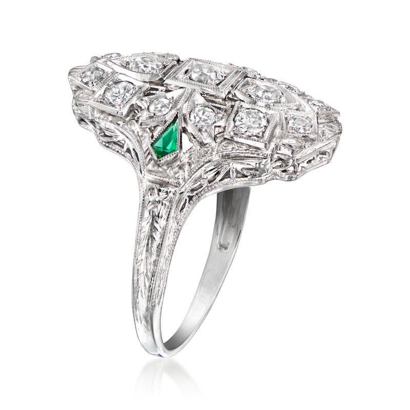 Vintage white-gold diamond dinner ring, green accents, ornate geometric setting