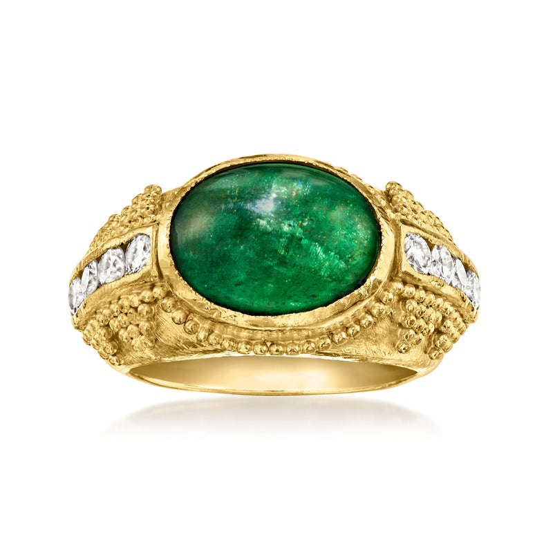 Vintage emerald ring in 24kt yellow gold with oval green gemstone and diamond side accents