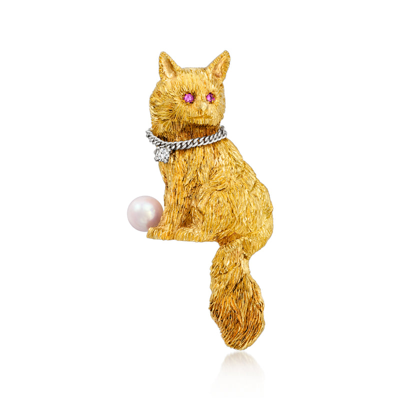 Two-tone gold cat pin with pearl accent and red gem eyes