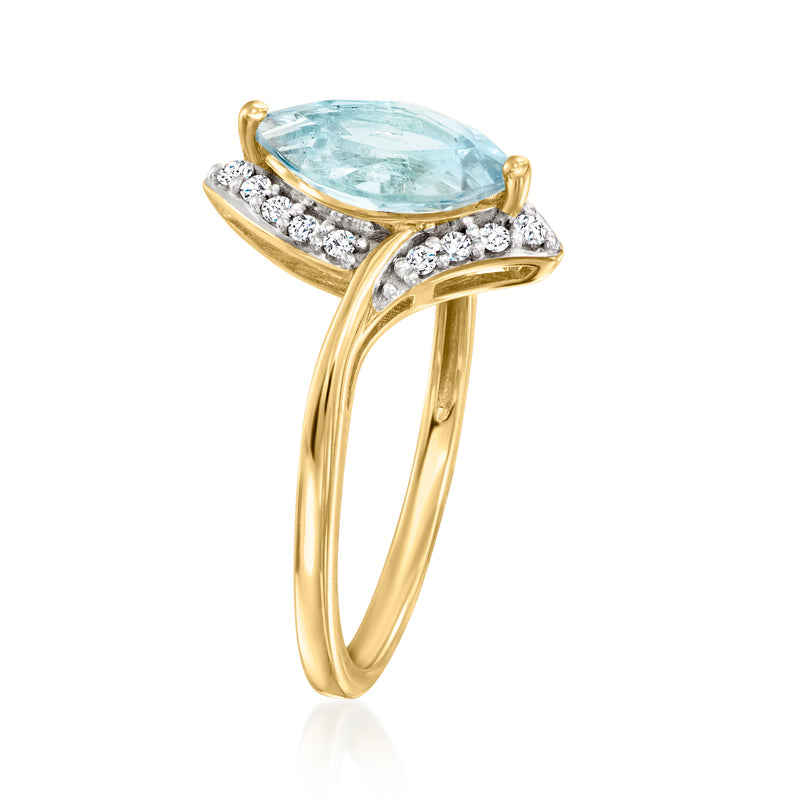 Pear-shaped sky blue topaz ring with white diamond accents and yellow gold band