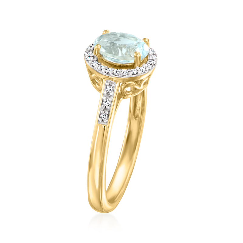 Oval sky blue topaz ring in 10kt yellow gold with diamond halo and side prongs