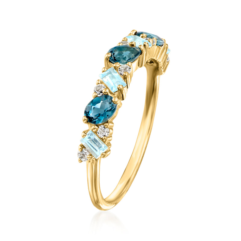 Curved 10kt yellow gold band with oval blue topaz and small white stones