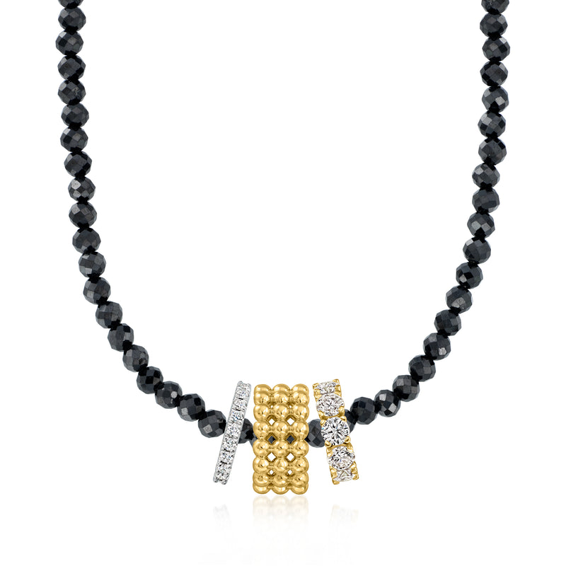 Black faceted bead necklace with gold three-row bead charm and glittery side details