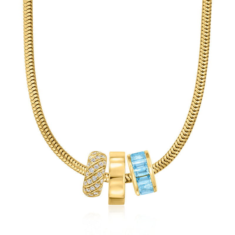 18kt gold over sterling polished bead charm on chain with crystal and blue accents
