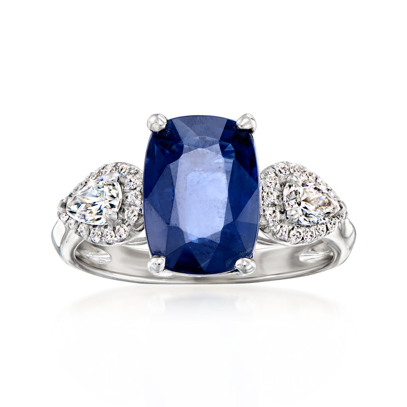 18kt white gold ring with cushion-cut blue sapphire and diamond side clusters