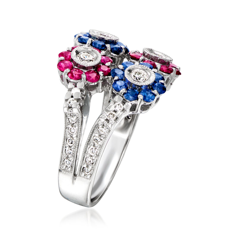 Side view of white gold flower cluster ring with pink rubies, blue sapphires, diamonds.