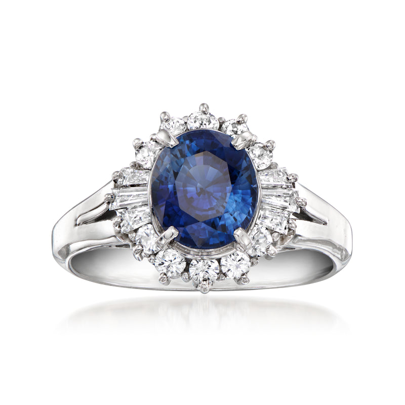 Platinum sapphire oval center ring with diamond halo and prong-set side stones