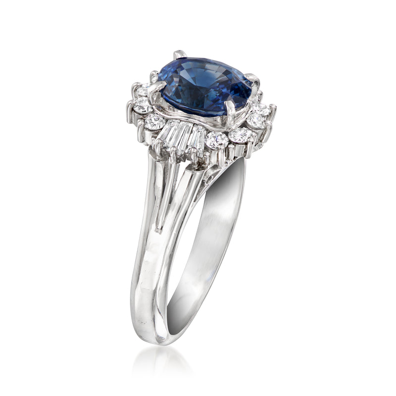 Platinum ring showing oval blue sapphire with baguette-style diamond settings