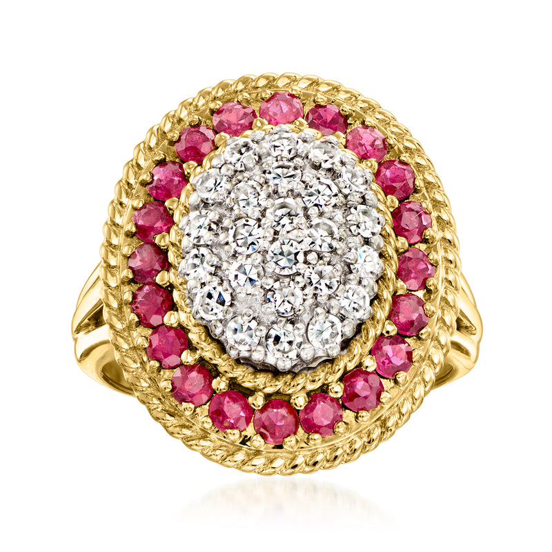 Gold cocktail ring with pink ruby stones and round diamond cluster center