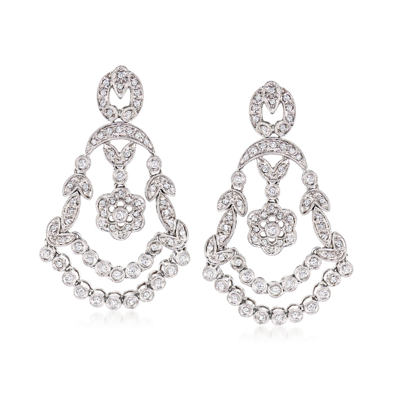 White gold chandelier diamond-look post earrings with circular floral center and teardrop dangles