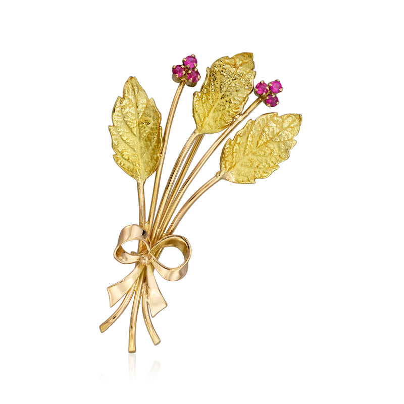 Vintage yellow gold leaf pin with textured polished finish and small pink gemstone accents