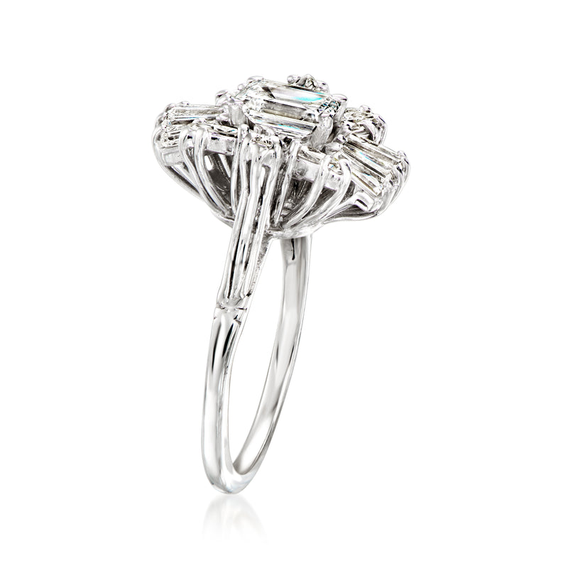 Diamond cluster ring side view, emerald-cut center with surrounding baguette stones, white gold