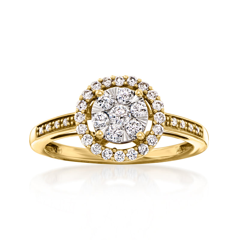 Vintage yellow gold diamond cluster ring with round halo stones and center round diamond