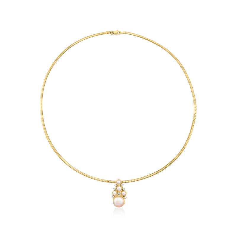 Gold pendant necklace with cultured pearl drop and diamond accents on thin chain