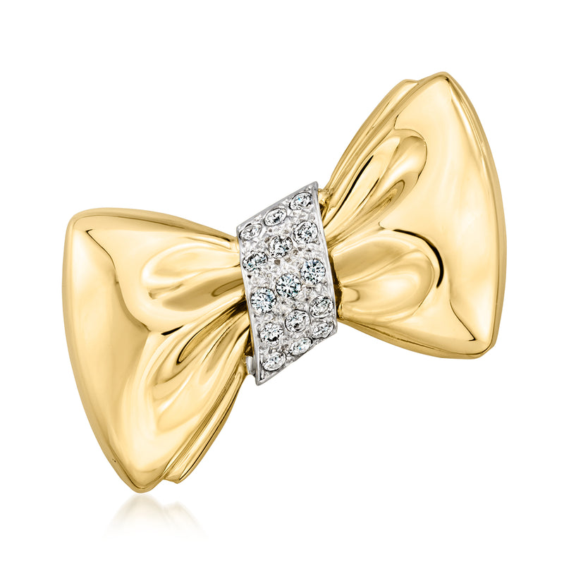 Two-tone gold diamond bow pin with faceted stone centerpiece, polished finish.