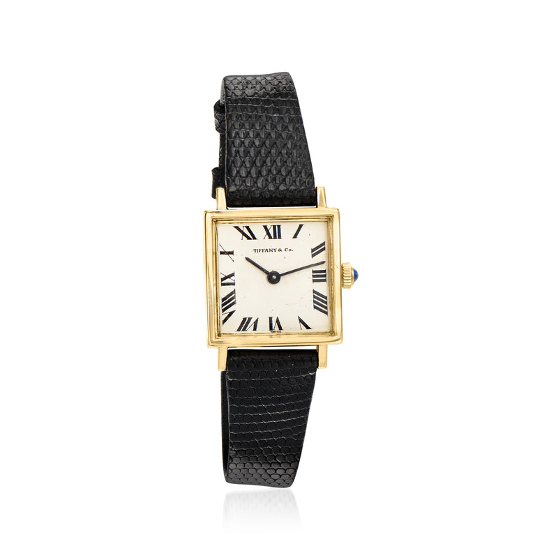 Vintage 14kt yellow gold watch with black leather strap and rectangular silver dial, Roman numerals