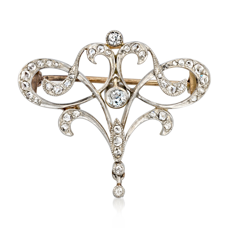 Vintage openwork scroll diamond pin in platinum with round accents