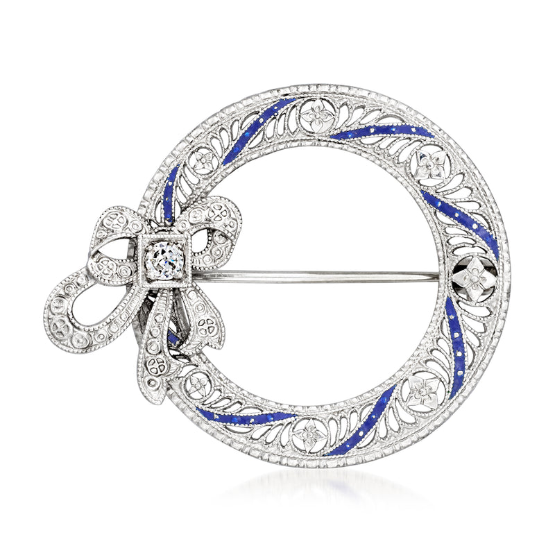 White gold bow pin with blue enamel oval and single round diamond