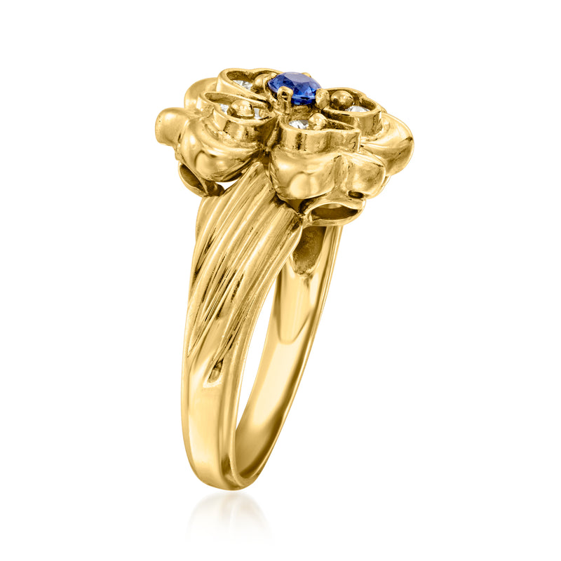 Yellow gold four-leaf clover ring side view with blue sapphire and diamond settings