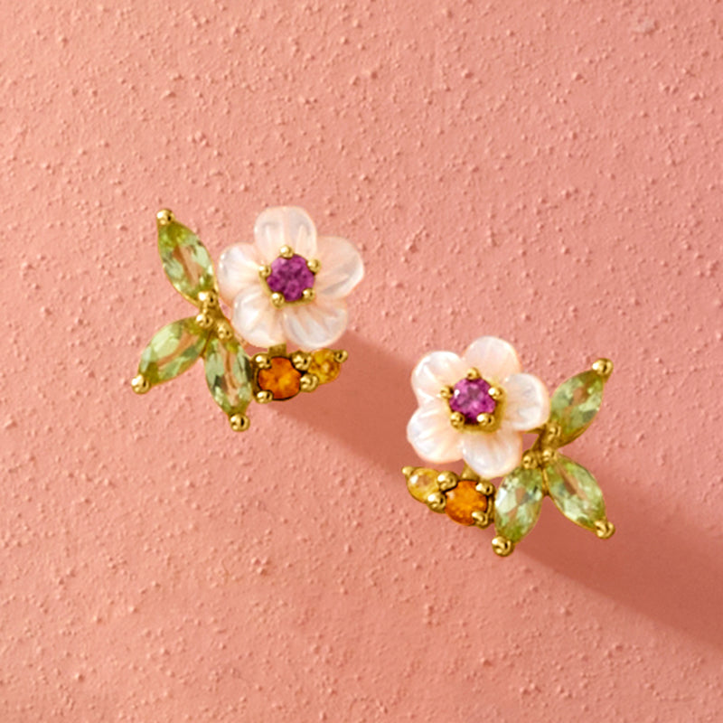 Gold flower stud earrings with mother-of-pearl blossoms, purple center and green/orange accents