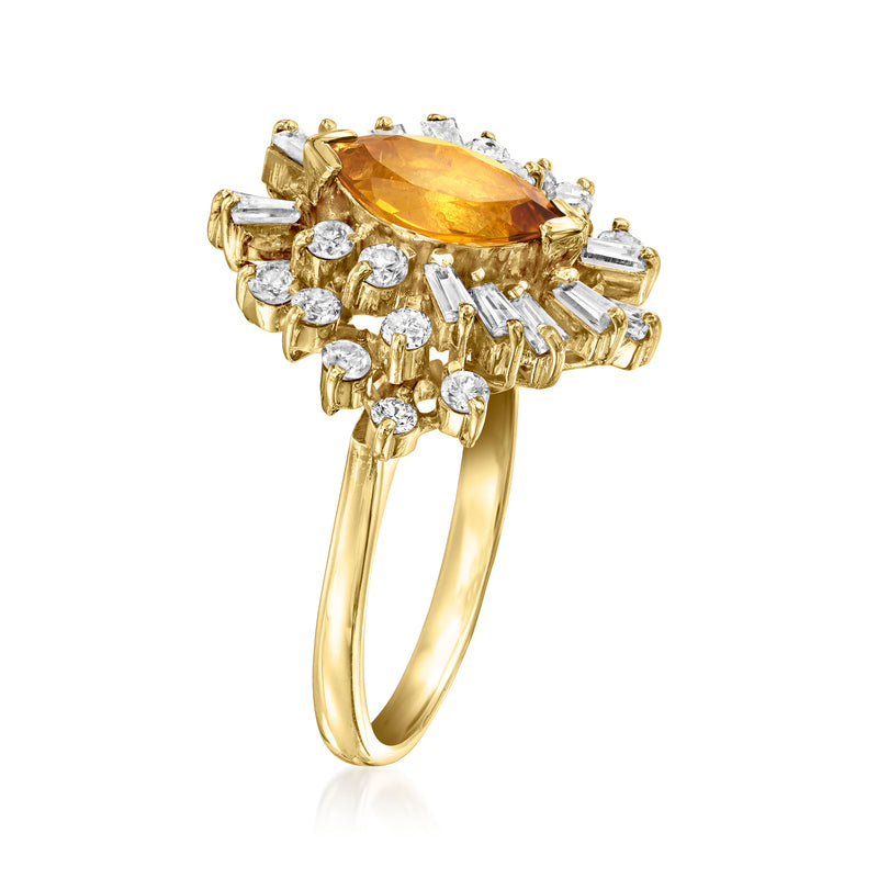 14kt yellow gold ring with orange citrine centerpiece and baguette diamond surround