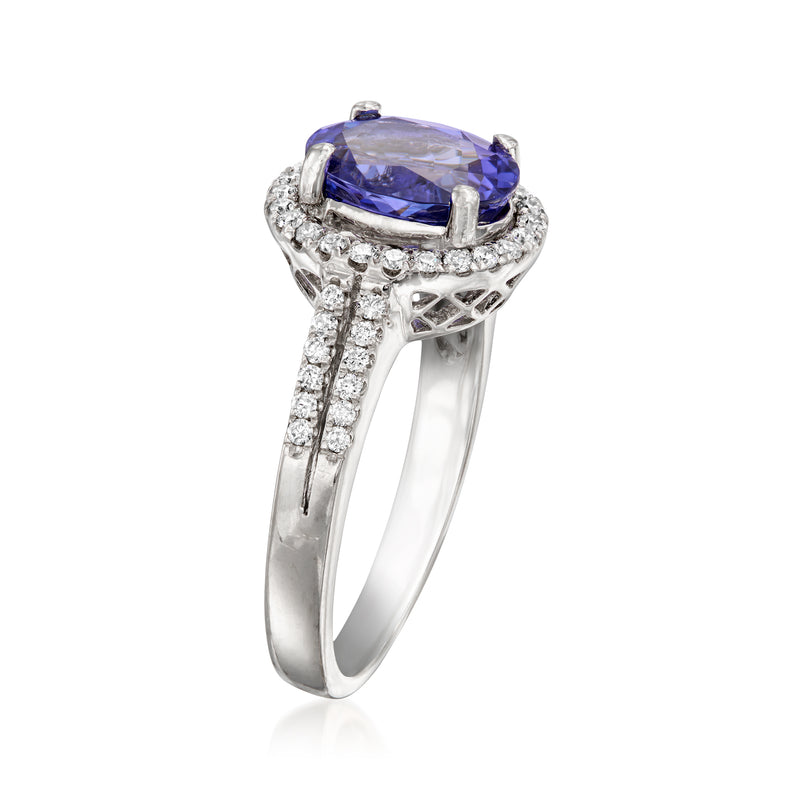 Tanzanite oval ring with diamond halo and white prongs, 18kt white gold