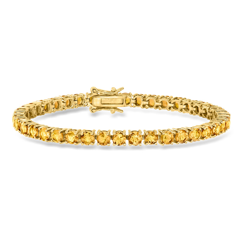Gold-over-sterling citrine tennis bracelet with secure clasp and gold-tone settings.