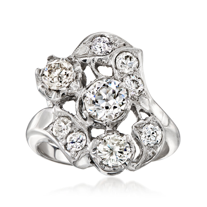 Vintage diamond cluster ring in 14kt white gold with round stones and ornate prongs