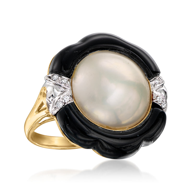 Cultured mabe pearl ring in black oval bezel with diamond halo and yellow gold shank