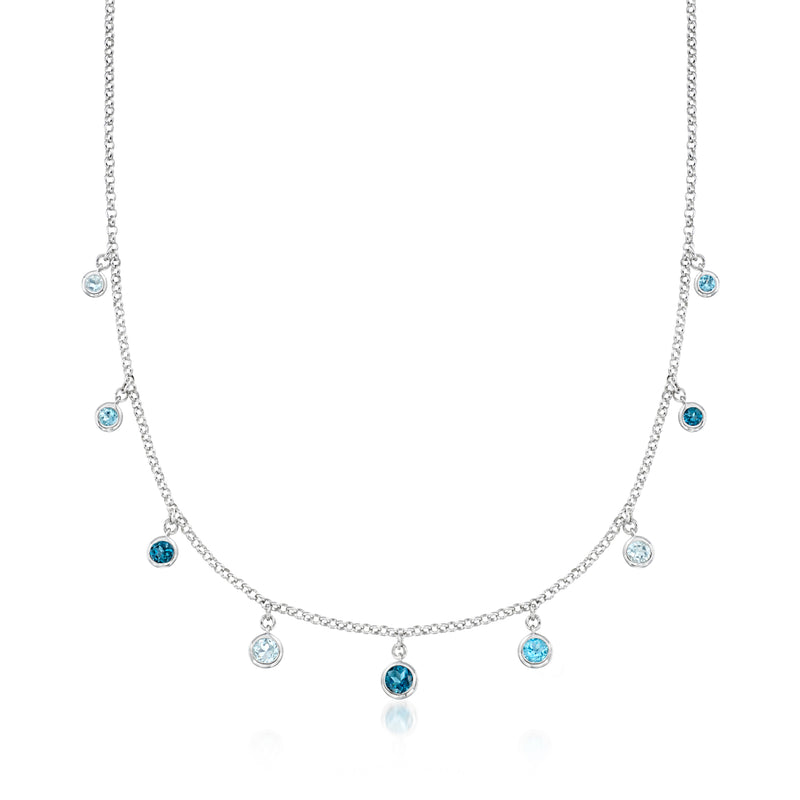 Sterling silver station necklace with bezel-set round blue topaz stones