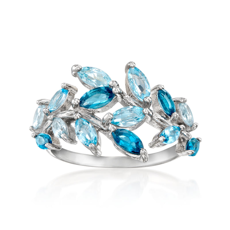Sterling silver vine ring with oval blue topaz gemstones, prong-set.