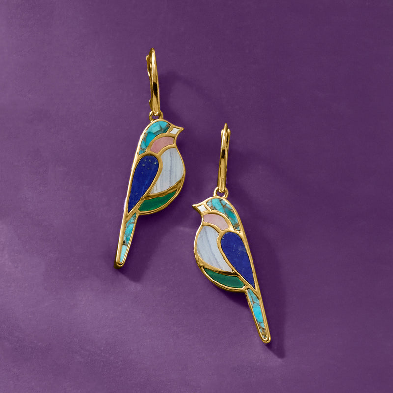 Gold bird drop leverback earrings, side view with blue and teal stone accents