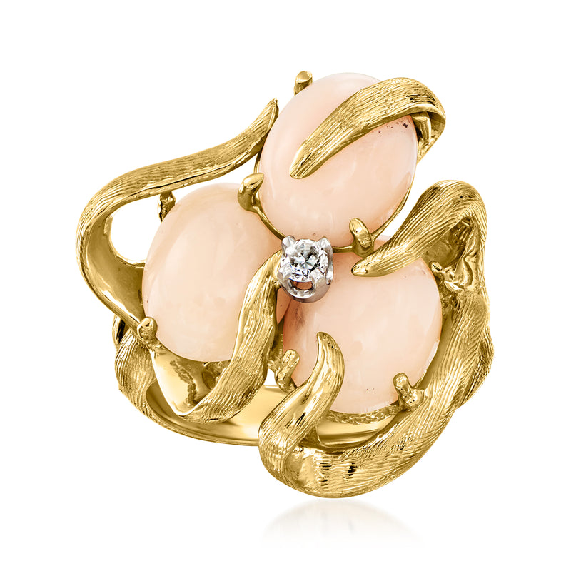 Gold-tone vintage ring with pink coral-style stones and one round diamond bezel