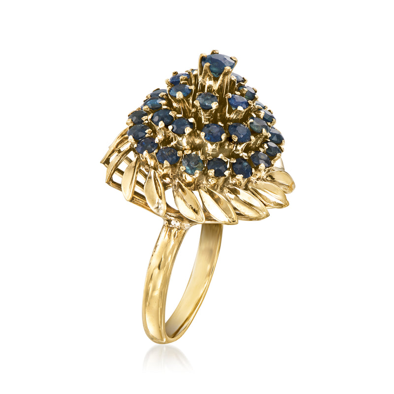 Yellow gold sapphire cluster ring with domed blue stones and curved open band